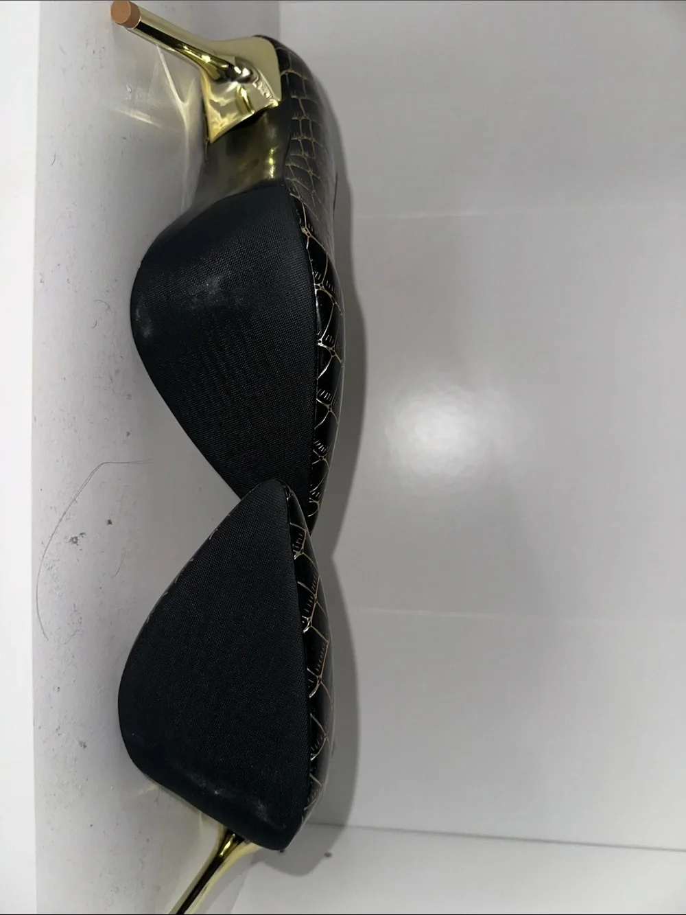 Black and gold heels